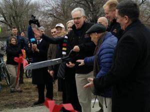 Governor Nixon, State Parks Director Bill Bryan, Darwin Hindman, and others cut the ribbon on the new 47.5 mile section of Rock Island Trail State Park.
